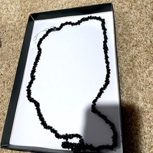 Long hematite necklace.